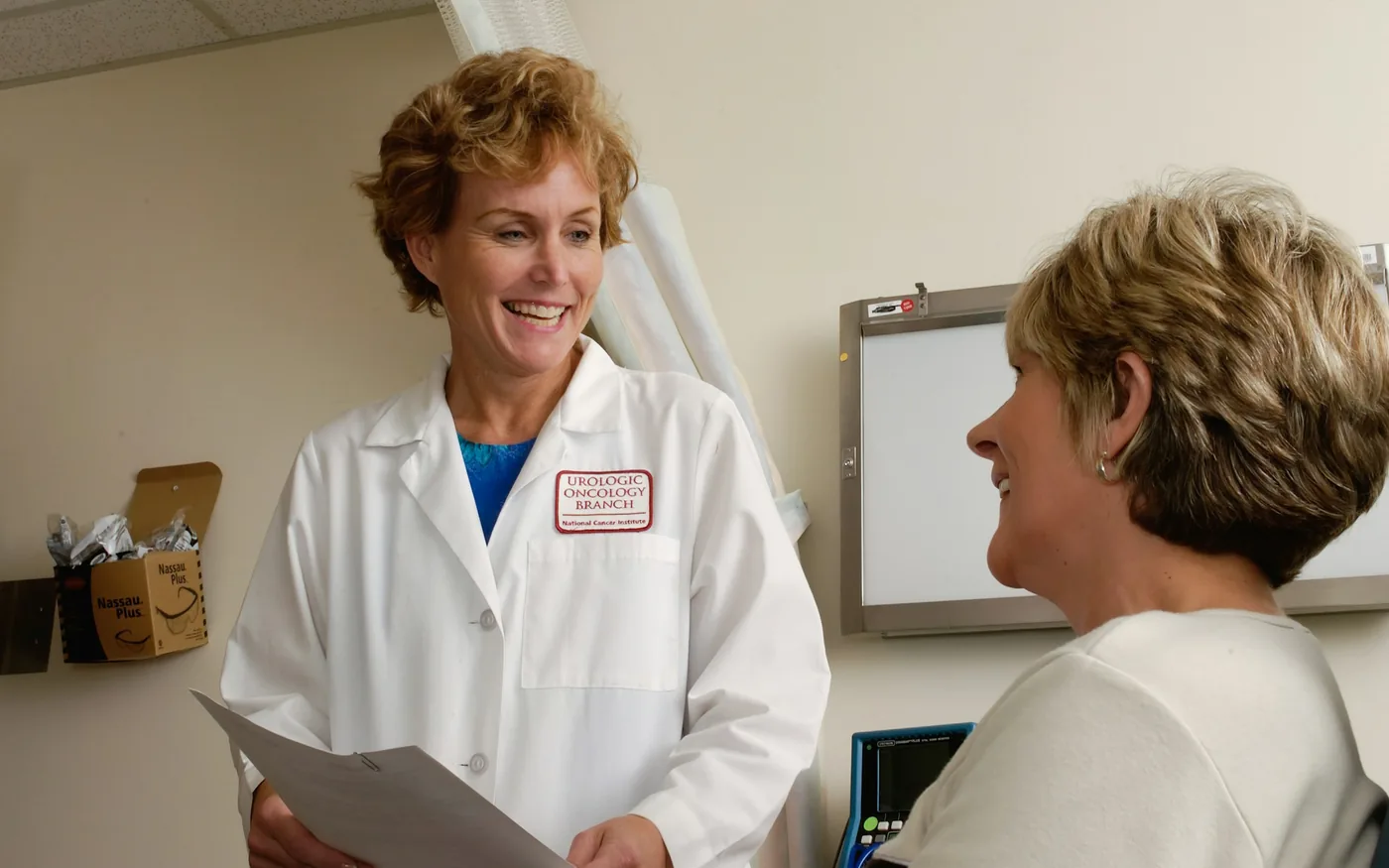 A practitioner taking a health history before the first treatment