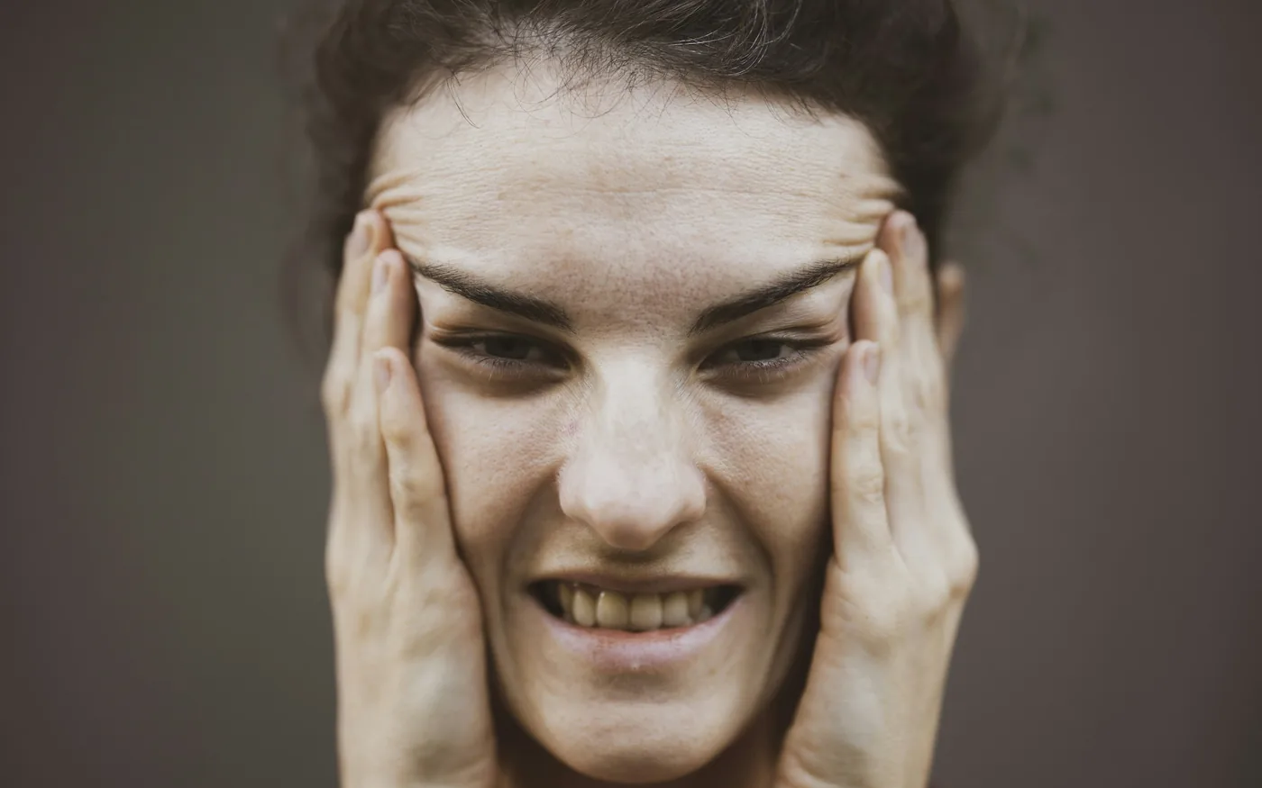 TMJ pain is felt at the jaw joint, the cheek and often the temple