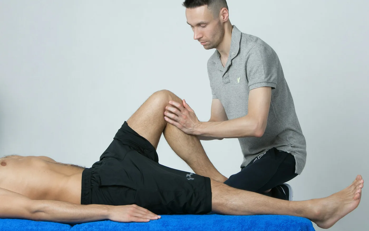 Needles placed around the knee joint during a session