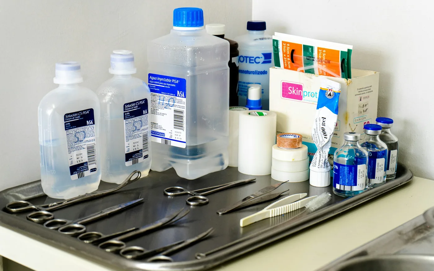 A prepared tray of single-use needles before a session