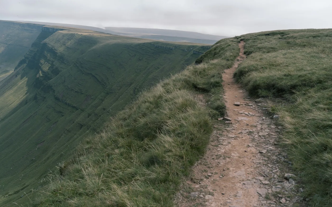 Downhill running and cambered roads both concentrate the load