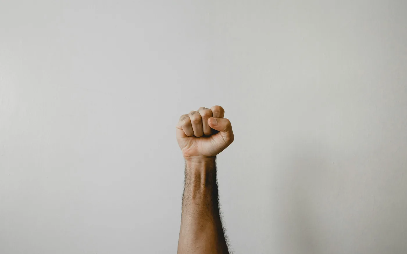 Tucking the thumb into a fist and bending the wrist reproduces the pain
