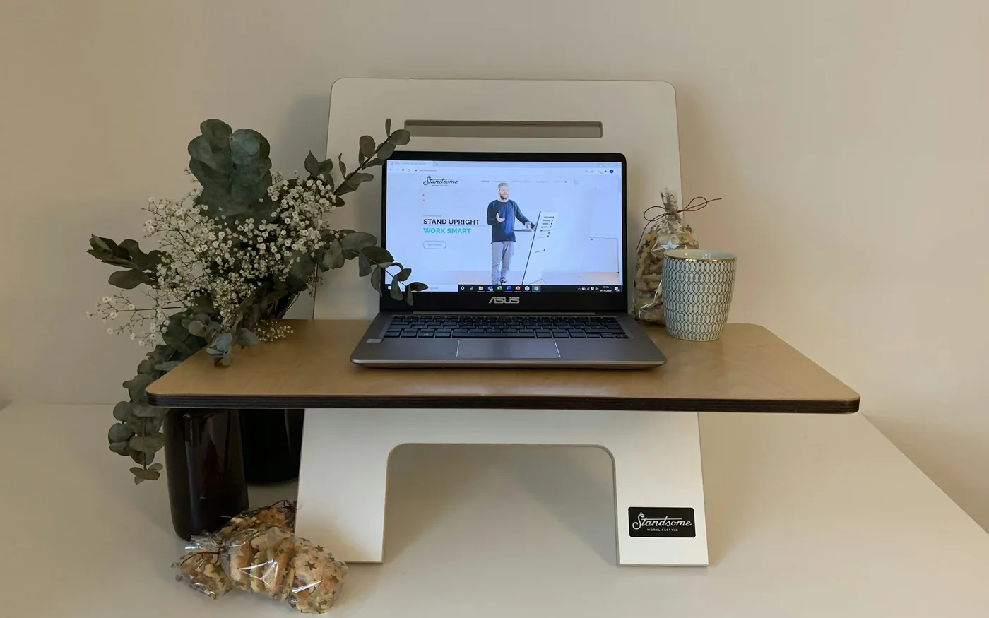A laptop used alone forces a compromise; raising it solves half the problem