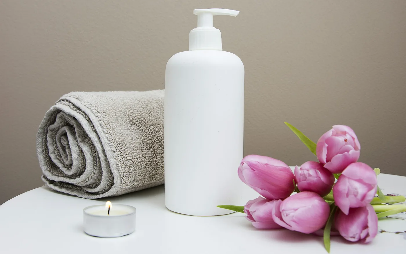 Oils and fresh linen set out before a massage appointment