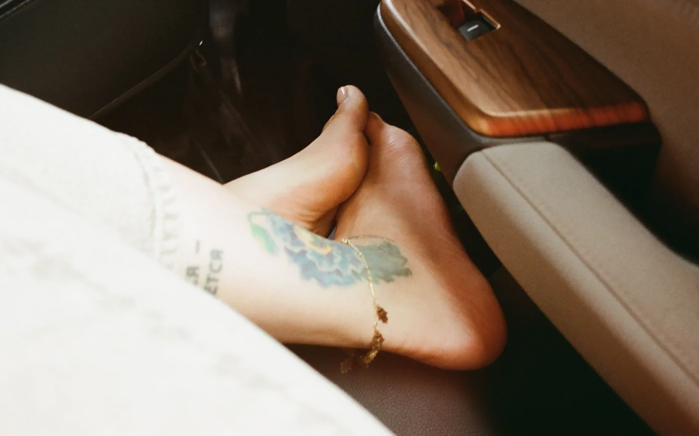 Mid-portion pain sits a few centimetres above the heel bone; insertional pain sits on it