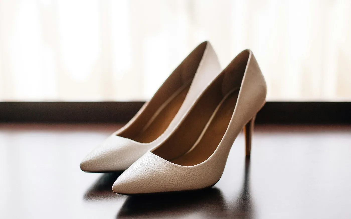 Narrow toe boxes and raised heels crowd the nerve between the toes