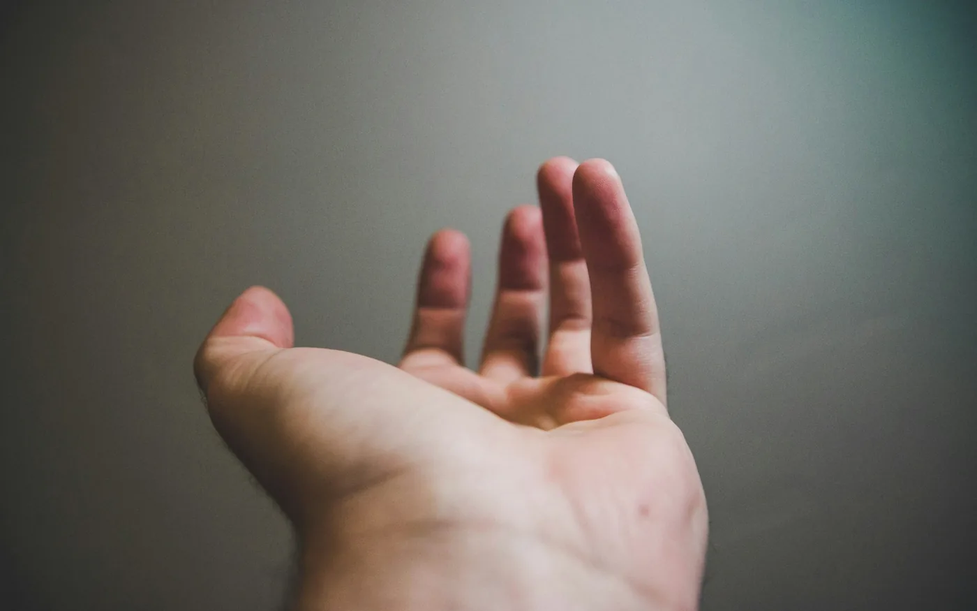 A tender nodule sits in the palm at the base of the affected finger