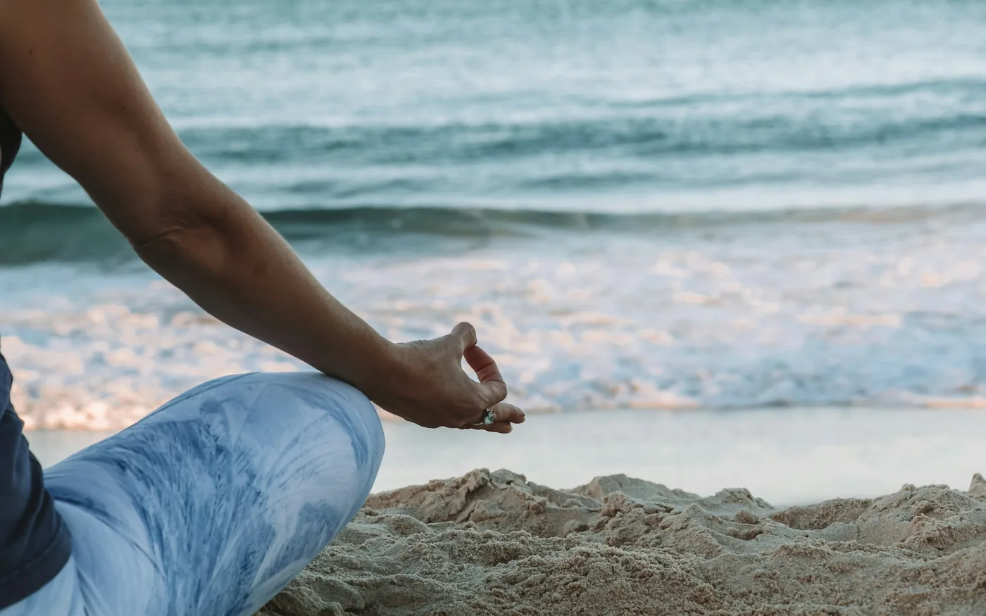 Hands resting during slow breathing, used to settle the nervous system